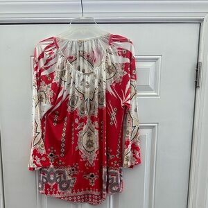 Pretty Reba top, Size L.  Orange and cream with sequins on front.  New.